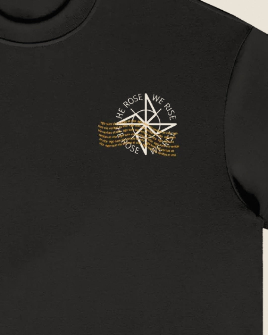 Close-up of the compass chest print on the tee